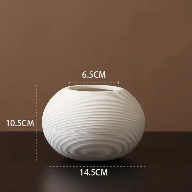 he M-sized Ceramic & Porcelain Tabletop Vase